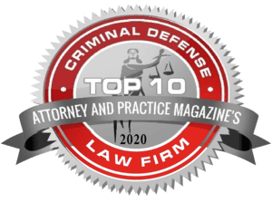 Seal with text: "Criminal Defense Top 10 Attorney and Practice Magazine's 2020 Law Firm." Features a stylized image of a justice figure.