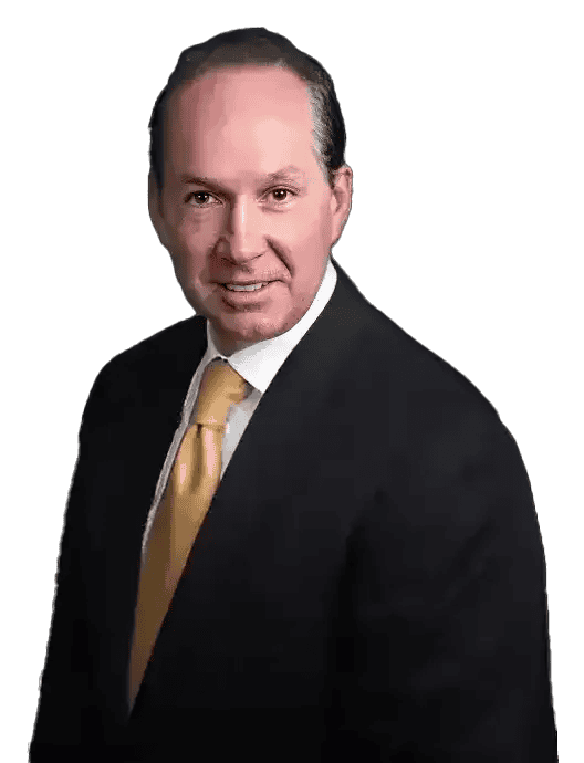 A man in a suit and a yellow tie smiles against a black background.